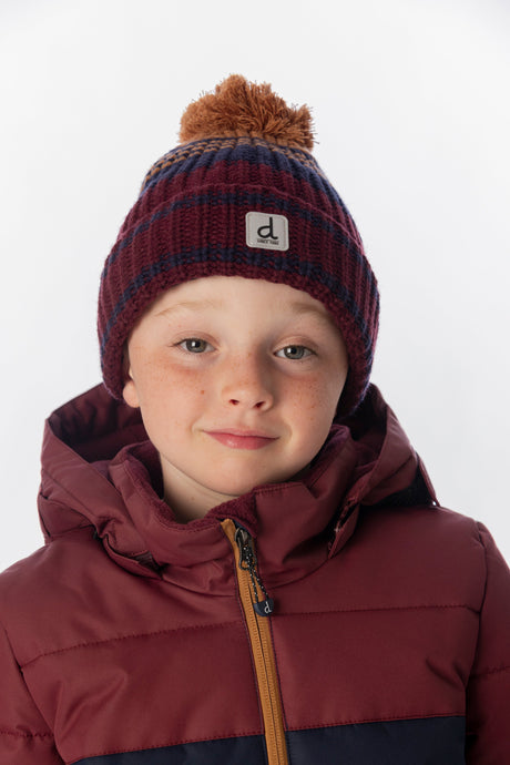 Child wearing the Deux par Deux burgundy and brown jacquard pompom hat
