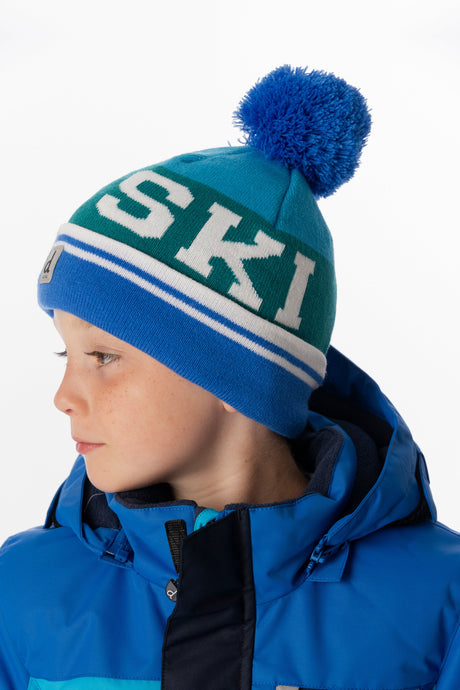 Child wearing the Deux par Deux dark blue and turquoise SKI band pompom hat