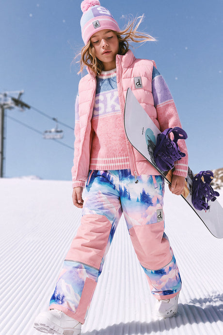 Child wearing the Deux par Deux light blue and light pink SKI band pompom hat, view 2