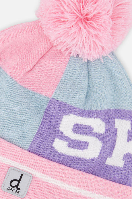 Close-up detail of the SKI lettering band and pink pompom on the Deux par Deux light blue and light pink hat