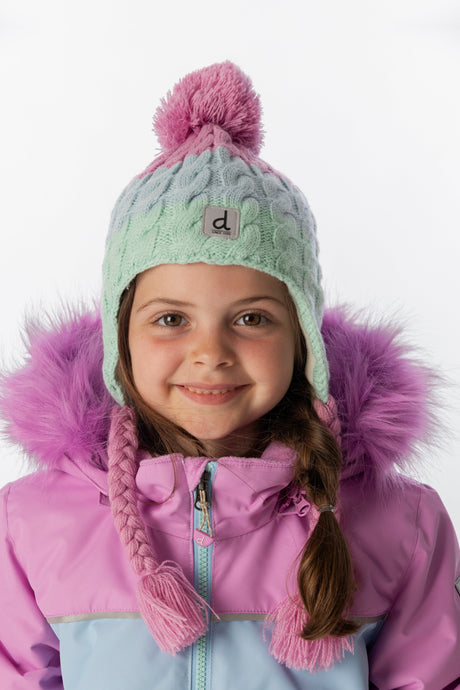 Child wearing the mint green, light blue and pinkish violet Deux par Deux Peruvian pompom hat, front view