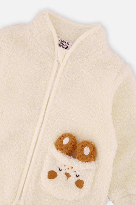 Close-up of the stand-up collar, zipper and bunny pocket on the off-white baby sherpa jacket
