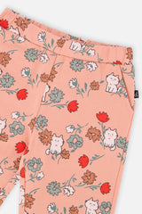 Close-up of the elastic waist and pocket on coral pink French terry sweatpants with a cat print