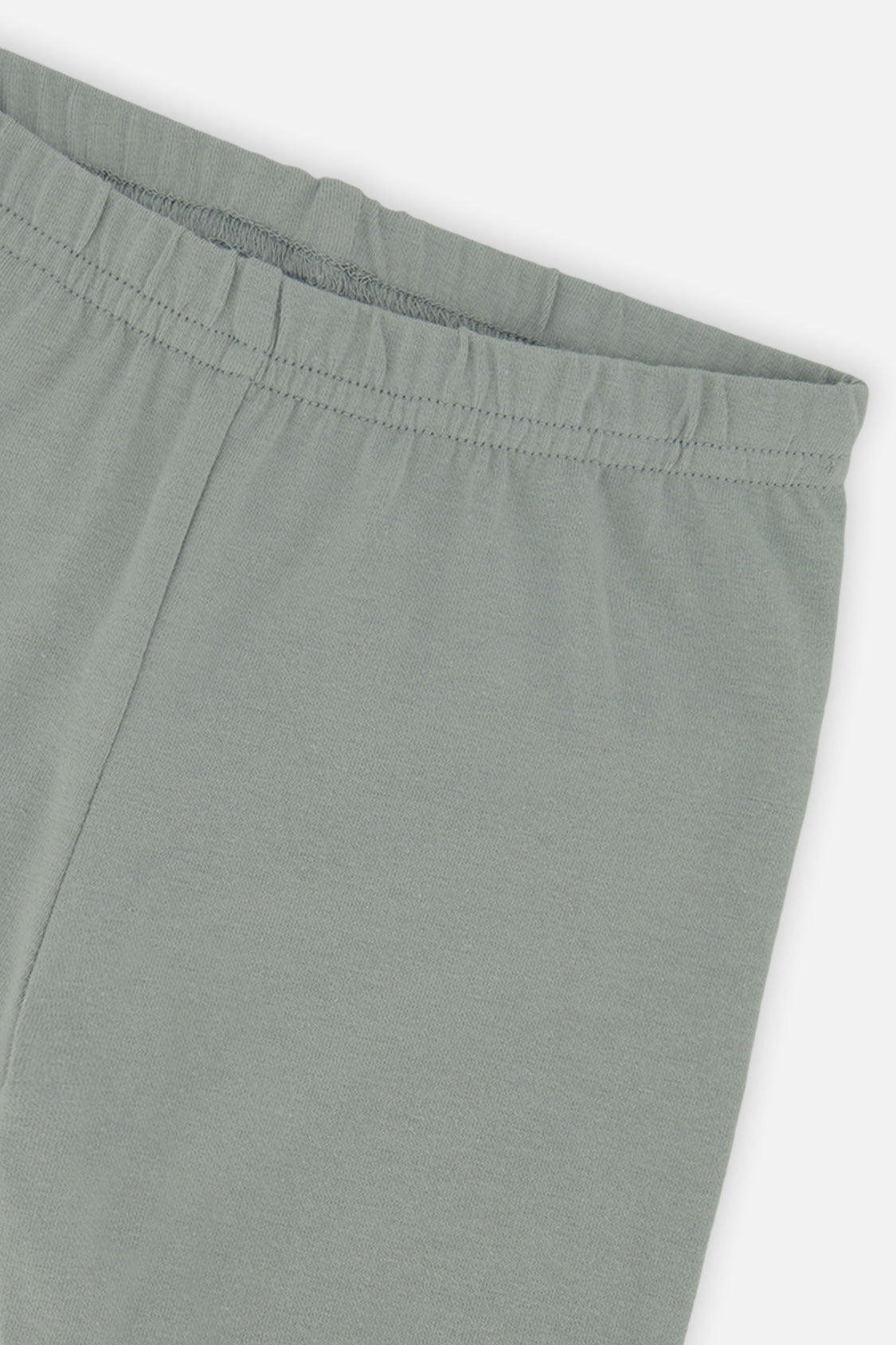 Close-up of the elastic waistband on the Deux par Deux sage green leggings