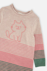 Close-up of the cat on the chest and the stripes of the knitted dress