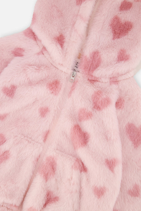 Close-up of the pale pink faux fur with jacquard hearts and the front zip on the jacket