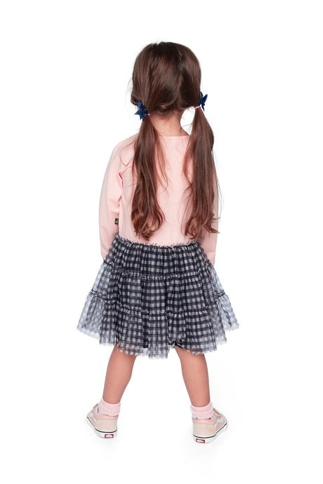 Child wearing the Deux par Deux pale pink dress with a gingham mesh skirt, back view