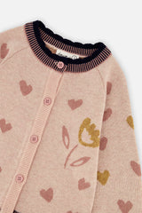 Close-up of the buttons, gold tulip and hearts on the pale pink Deux par Deux girls cardigan
