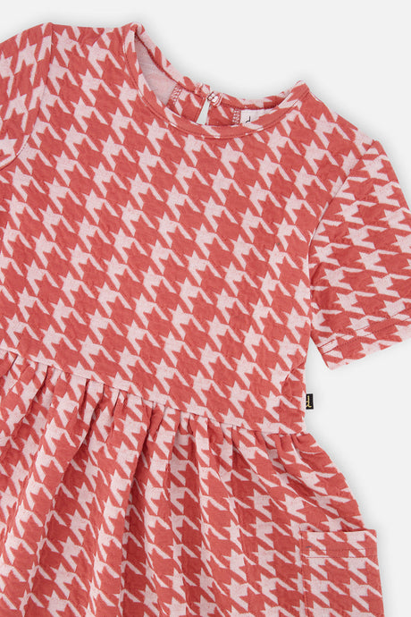 Close-up of the houndstooth jacquard and patch pocket on the Deux par Deux dress