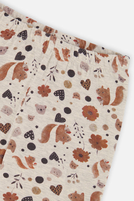 Close-up of the squirrel and flower print and waistband on the Deux par Deux beige leggings