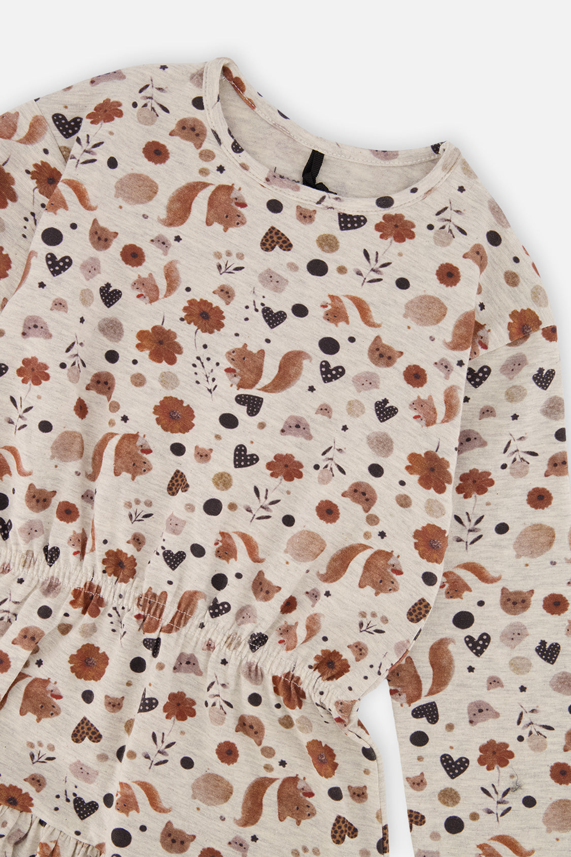 Close-up of the squirrel and flower and heart print on the Deux par Deux beige dress