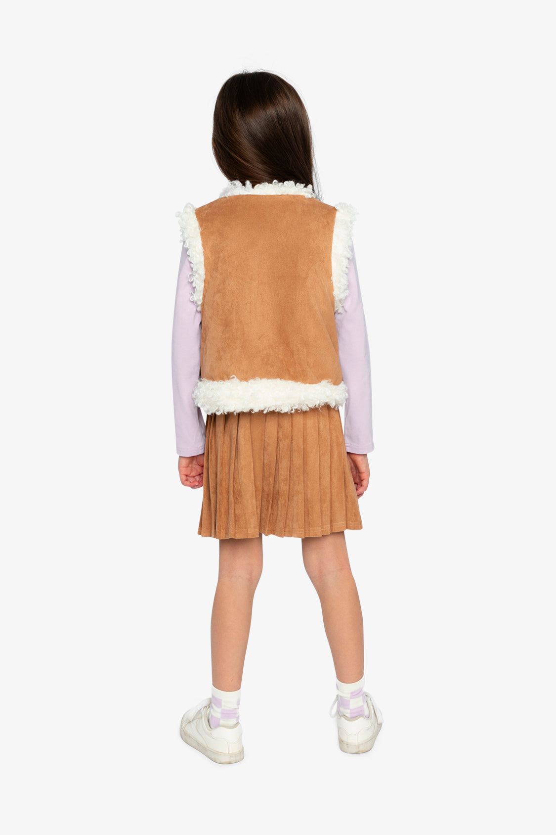 Back view of a child wearing the reversible vest with the brown side out and cream sherpa edging