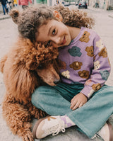 Child in the Deux par Deux purple poodle sweatshirt, lifestyle photo