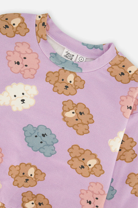 Close-up of the round neckline and the brown pink cream and blue poodle faces on the lilac Deux par Deux sweatshirt