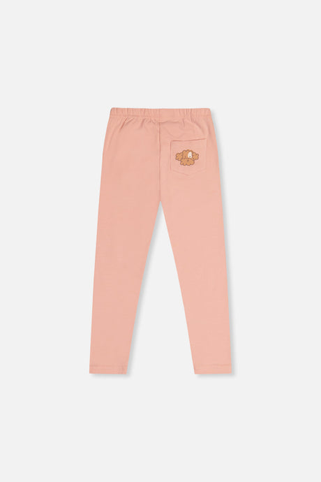 Deux par Deux girls peach pink leggings with a poodle face back pocket, back view laid flat
