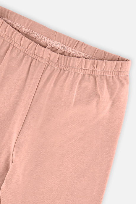 Close-up of the elastic waistband on the Deux par Deux peach pink leggings