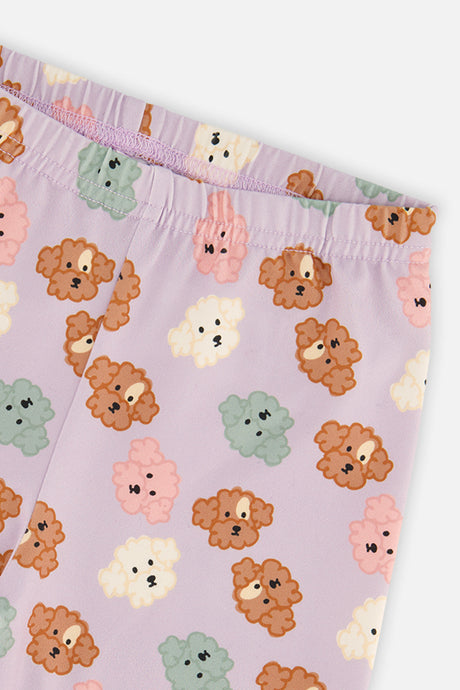 Close-up of the poodle face print and elastic waistband on the Deux par Deux lilac leggings