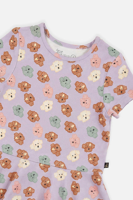 Close-up of the neckline and poodle face print on the Deux par Deux lilac dress