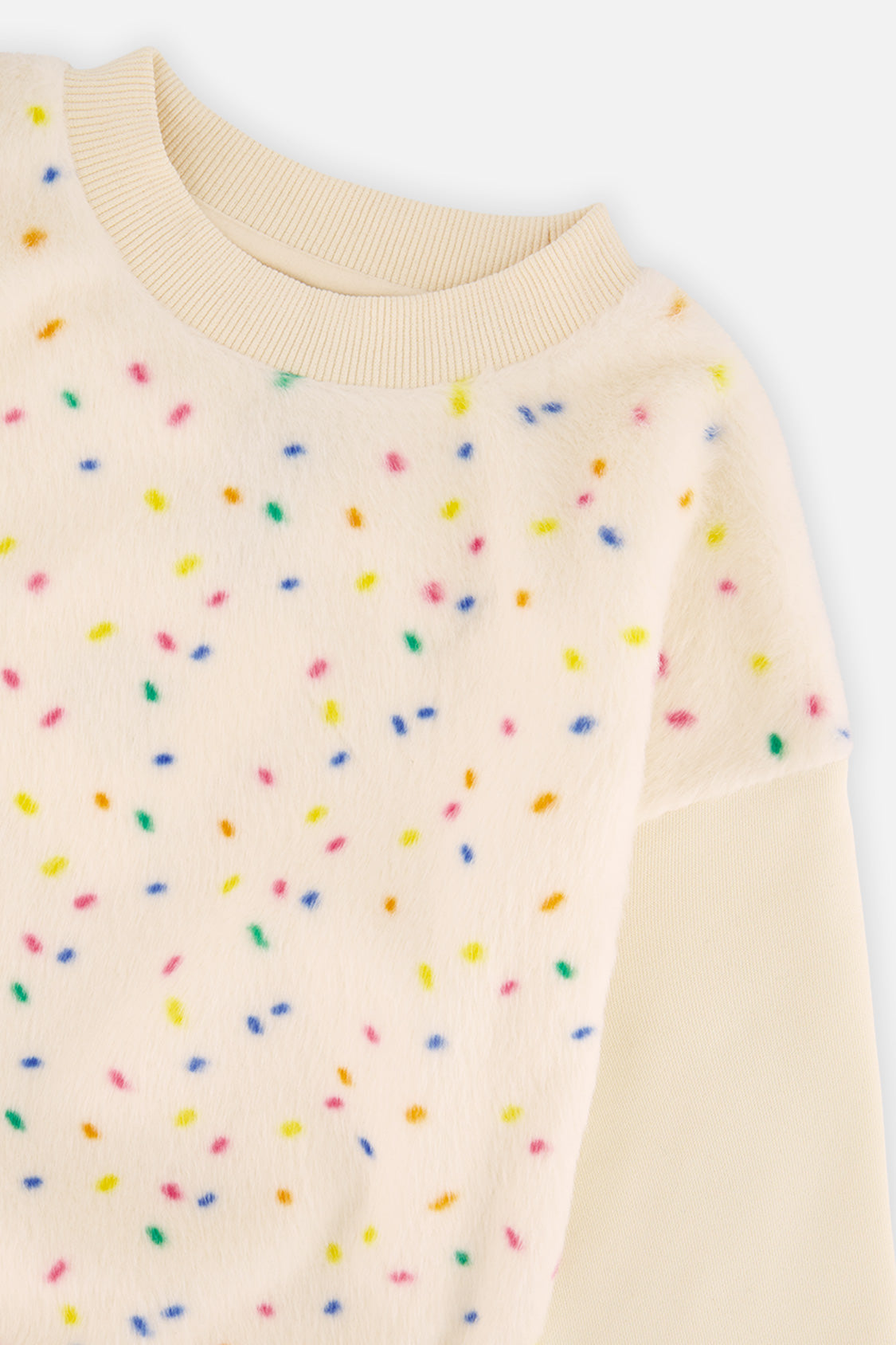 Close-up of the multicolor confetti faux fur panel on the Deux par Deux off-white sweatshirt