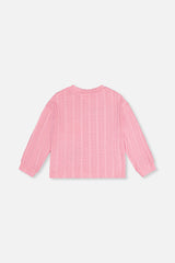 Back view of the pink knit top laid flat
