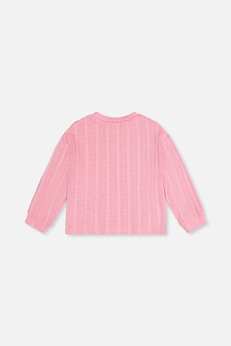 Back view of the pink knit top laid flat