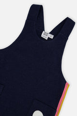 Close-up of the strap and pocket patch and rainbow side stripe on the Deux par Deux navy dress