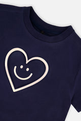 Deux par Deux girls' dark blue jersey T-shirt with holographic heart – close-up of the embossed heart