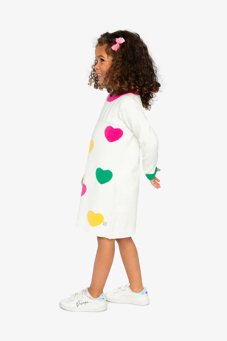 Child wearing the off-white heart knitted dress, side view