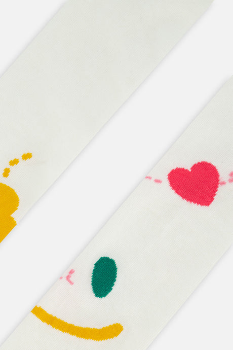 Close-up of the yellow, green and pink smiley face graphic on the off-white Deux par Deux knit tights