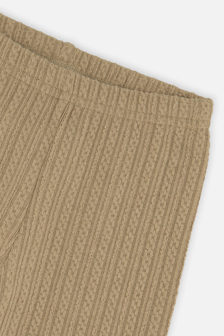 Close-up of the ribbed jacquard pattern and waistband on the Deux par Deux tan leggings