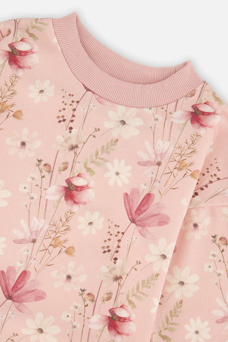 Close-up of the flower print and ribbed neckline on the Deux par Deux pink French terry dress