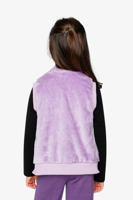 Back view of a child wearing the violet faux fur vest, plush pile with a ribbed hem