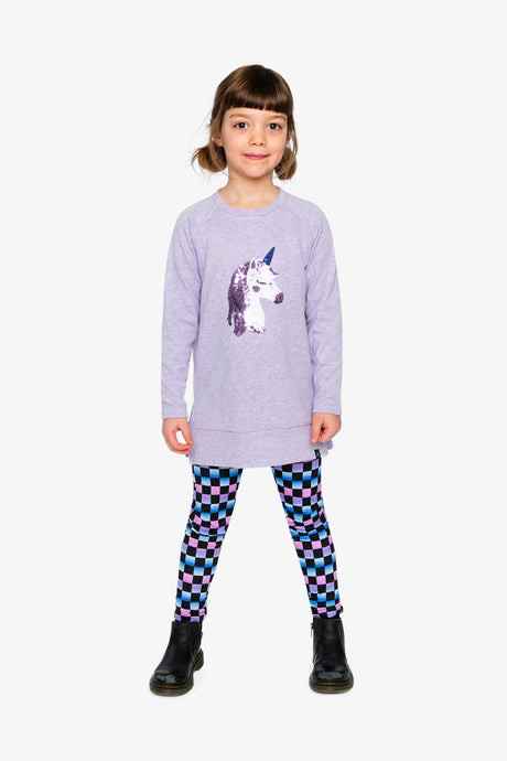Child wearing the Deux par Deux checkerboard print leggings with a unicorn tunic, full length