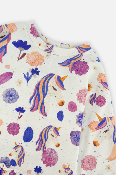 Close-up of the unicorn and flower print and crew neckline on the Deux par Deux cream dress