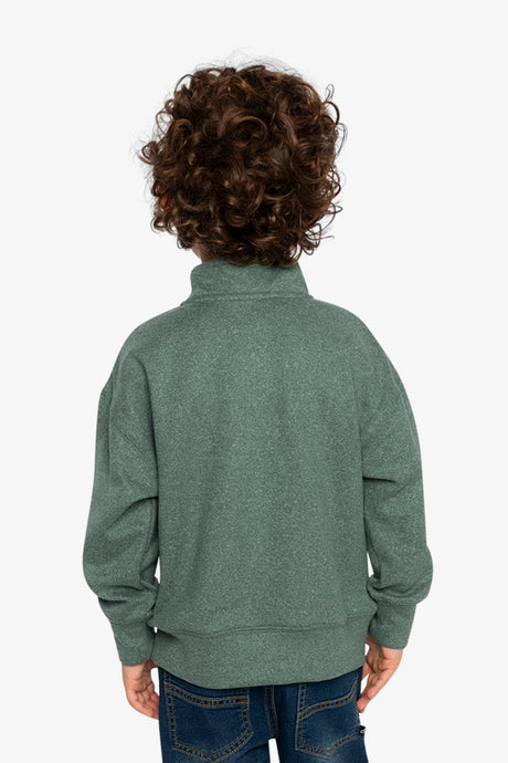 Child wearing the dark green half-zip sweater, back view
