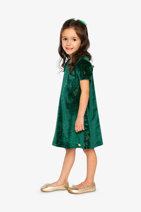 Child wearing the Deux par Deux forest green sparkle velour dress, side view