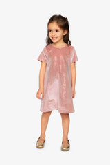 Child wearing the Deux par Deux dusty pink dotted velour dress and gold flats