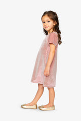 Child wearing the Deux par Deux dusty pink dotted velour dress, side view