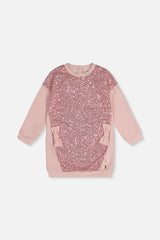 Front view of the dusty pink sweatshirt dress with a sequin front panel and side bows