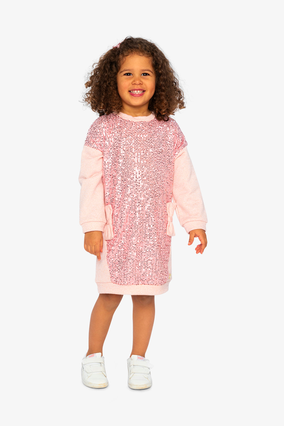 Child wearing the dusty pink sequin sweatshirt dress, front view
