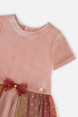 Close-up of the velvet bodice and burgundy bow on the Deux par Deux pink gradient dress
