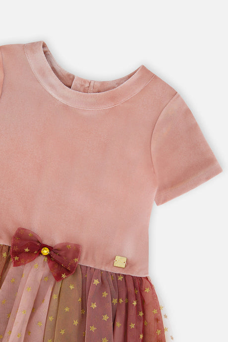 Close-up of the velvet bodice and burgundy bow on the Deux par Deux pink gradient dress
