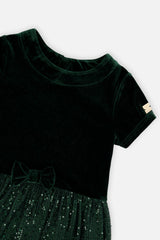 Close-up of the velvet neckline and bow on the Deux par Deux green party dress
