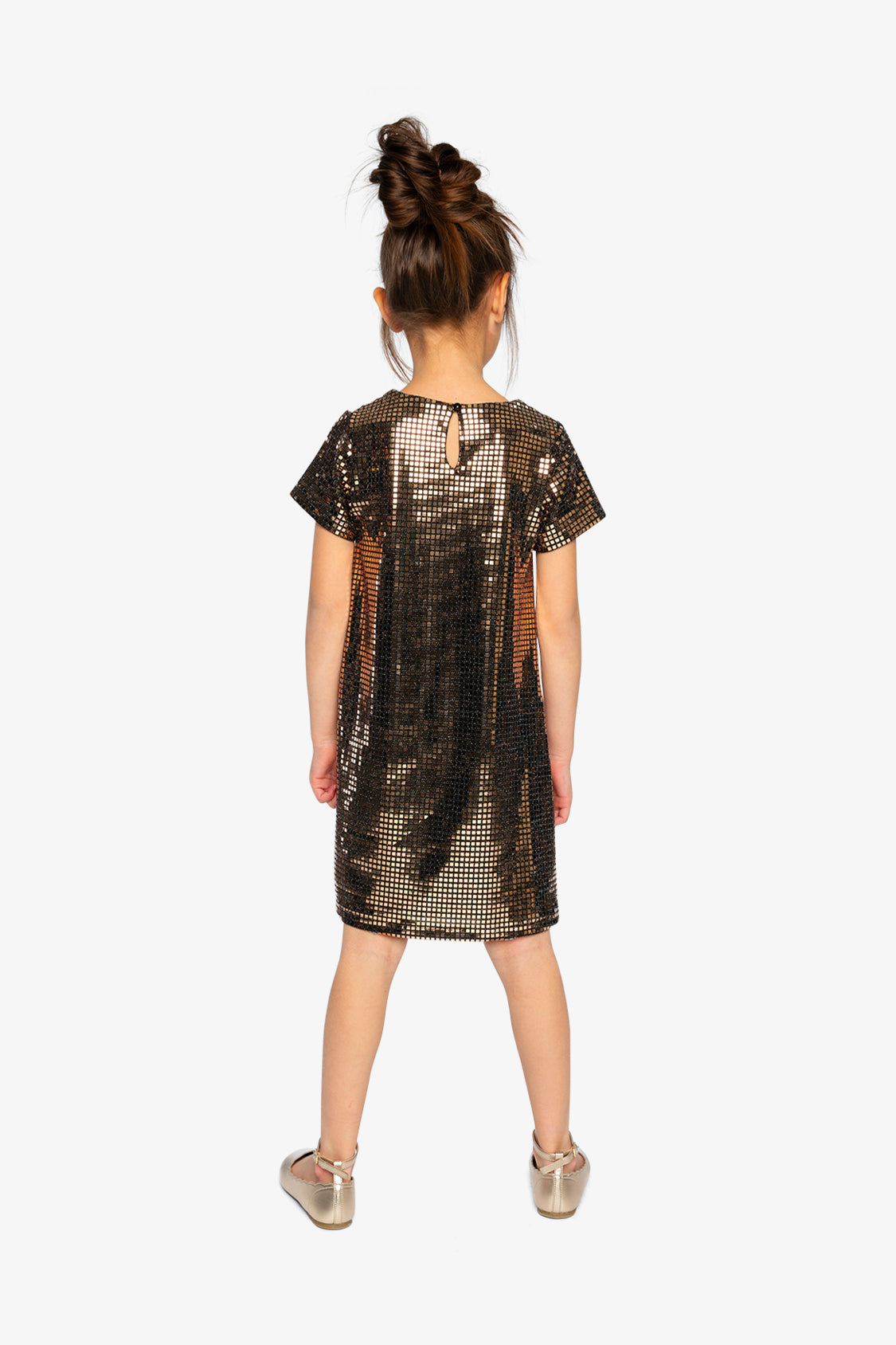 Child wearing the Deux par Deux metallic bronze gold A-line dress, back view