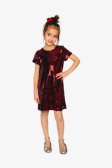 Child wearing the Deux par Deux red metallic A-line dress with gold ballet flats