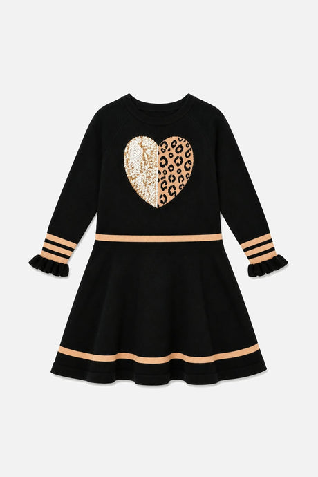 Front view of the black knit dress with beige stripes, ruffle cuffs and a heart on the chest