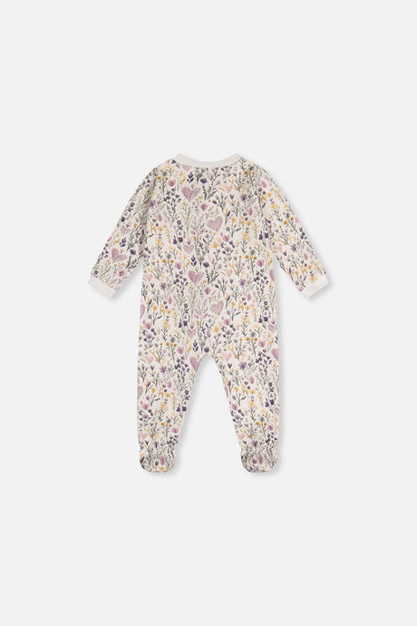 Back view of the beige footed pajama printed with lilac hearts and wildflowers
