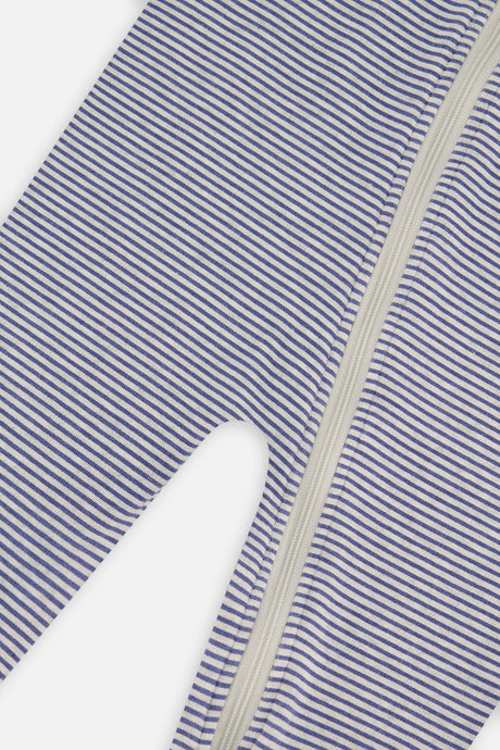 Close-up of the thin blue and white stripes and the zipper down the front of the footed pajama