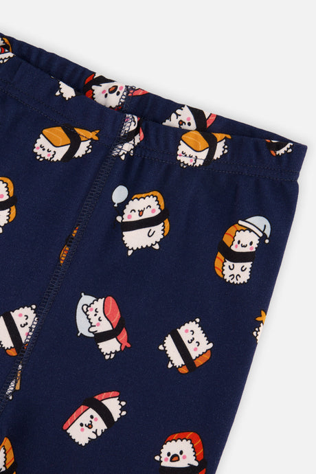 Close-up of the elastic waistband and the smiling nigiri sushi print on the navy pajama pants