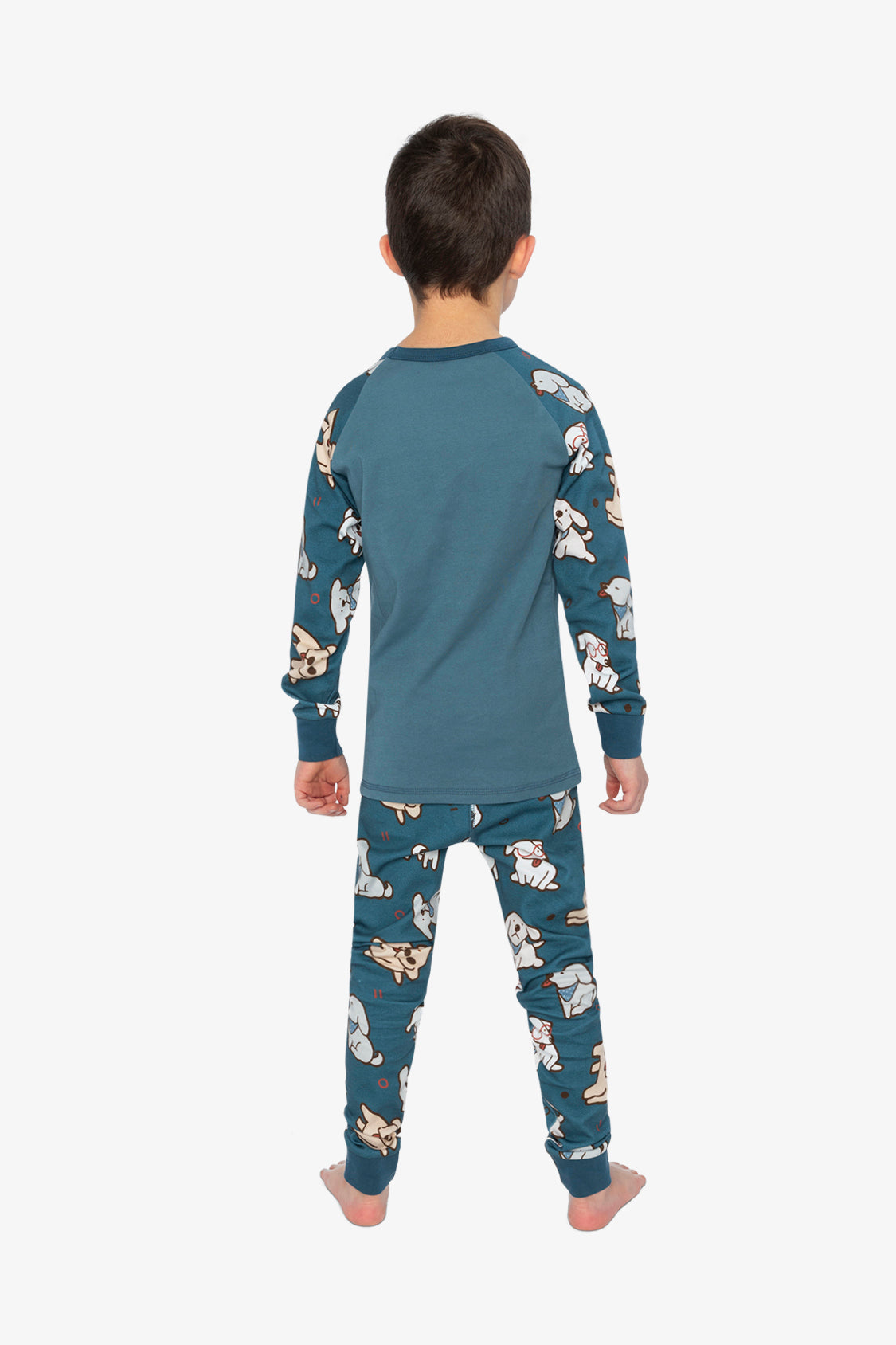 Child wearing the turquoise dog pajama set from behind